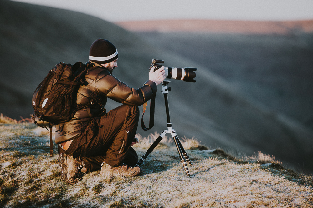 Landscape photographer working in cold